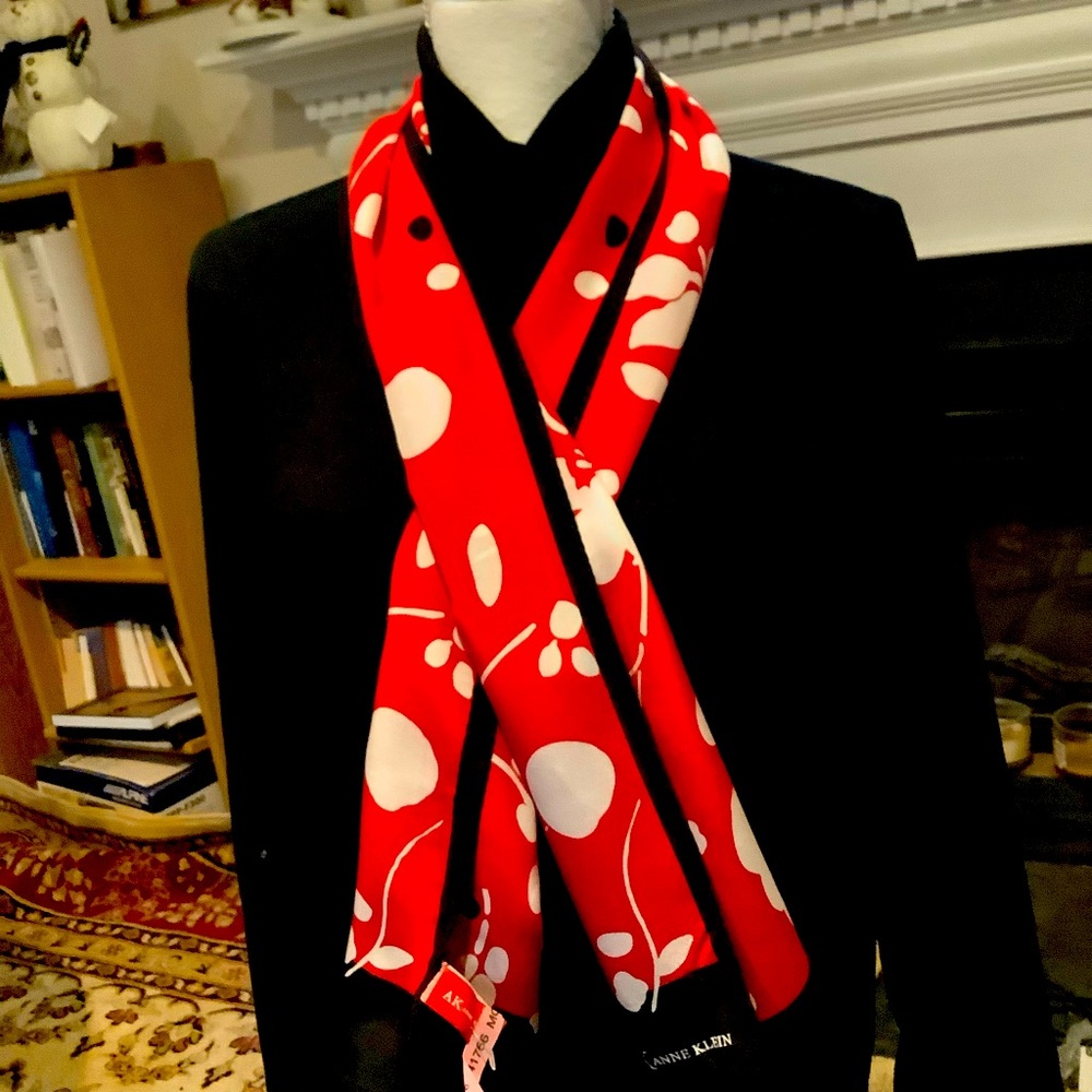 This 100% silk 4’4” scarf is designed by Anne Klein.